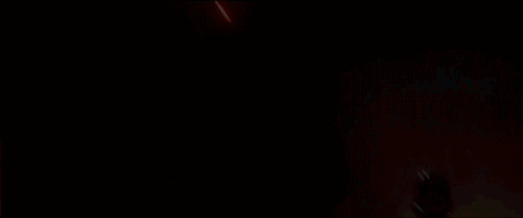 Kylo Ren swings his lightsaber